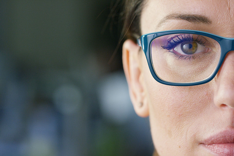 Portrait of a beautiful girl with glasses, with green eyes, shot